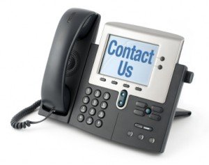 telephone with text on the screen saying "Contact Us"