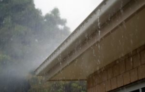 water in the basement waterproofing gutters