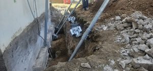 Image showing piers being installed on the side of a home. 